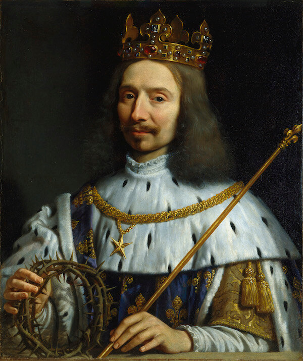  Изображения какого цветка добавил французский король Людовик IX в свой герб в честь любимой жены?