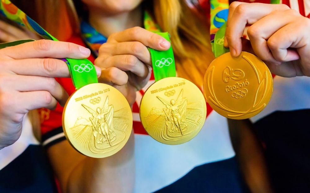 Сколько граммов золота должно содержаться в золотой олимпийской медали?